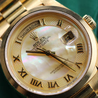 Rolex Day-Date 36mm, Mother of Pearl Gold Roman Dial, Smooth Bezel President (Ref. 18208)